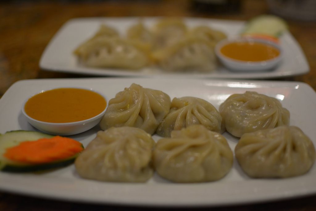 Vegetable Momos, steamed dumplings filled with minced vegetables and tofu.