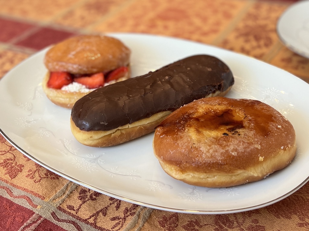 A strawberry shortcake doughnut, filled chocolate bar and crème brûlée doughnut are among the specialties offered at Cruel Donuts, a new San Mateo doughnut shop. 